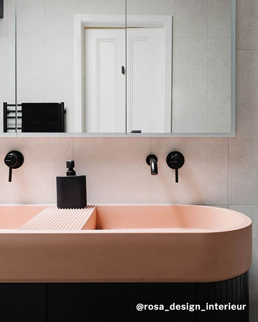 LED medicine cabinet decorating an oval shaped sink with wall-mounted faucet in a modern stylish bathroom